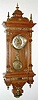 C.1903, (dated) German, Gustav Becker, Ornate Wall clock, oak case with 30 bits of cast brass decorations, and with fancy cast pendulum, serial 1,259,120, presentation piece. 