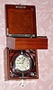 C.1915, Hamilton Watch Co., 21-jeweled 54-hour up down indicator deck watch in a gimbaled mahogany Hamilton box, with original key. Adjusted for 5 positions. Serial No. 1260636.