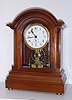 C.1906, [dated] English, Eureka Clock Co, Ltd, London, battery power mantel clock, in a quality mahogany case with reeded side columns w/ barss stop fluting, and featuring a large, seconds beating, vertical balance, serial No. 7421. 