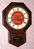 C.1890, New Haven, Drop Octagon, RC, with original "Lucky Strike" advertising dial for distributor R. A. Patterson Tobacco Co., this one for the Maine retailer named Shaw, Hammond and Garney, Portland, Maine [on bottom tablet], and with rear label. 