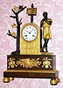 C.1850, French, A. Duminil, Paris,  8-day time and bell strike silk thread suspension figural mantel clock in the form of a Roman figure in a tunic standing and playing a flute. Retailed by Henard, Paris. 