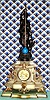 C.1880, French, Conical Pendulum clock, white marble with bronze patinated spelter statue, gilt ormolu trim on the case, and with its original gilt wood accent base.. 