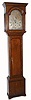 C.1810, English, John Russell, Falkirk,  8-day brass dial tall case, in a slender case of oak veneer with mahogany accents. 