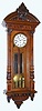 C.1875, Austrian, 3-Wt, Grand Sonnerie wall clock in walnut, with 3/4 columns, nicely carved and with original top bearing the face of the Northwind. 