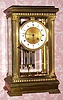C.1900, French, Japy Freres, 8-day time and strike crystal regulator mantel clock retailed by Black, Starr and Frost, New York, (on dial and movement) in a heavy cast brass case of Angle-riche style with full Corinthian columns at the corners and dentil trim.