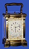 C.1900, French, Brass Cased Carriage clock, time, strike and repeat, in a Doucine variant case, and with hand painted ivory panels and dial mask, dial signed Tiffany and Co. See this same case style in A Century of Fine Carriage Clocks, Fanelli and Terwilliger [1987), clock No. 1 (page 15). 