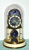 C.1954, J. Kaiser, G.M.B.H. 400-day timepiece with a moon phase dial, and terrestrial globe pendulum.