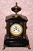 C.1900, French, Marti et Cie, 8-day time and bell strike black marble and ormolu mantel clock. Retailed by Alex M. Hays, New York. 
