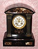C.1900, French, Marti et Cie, 8-day time/strike black marble with contrasting marble inserts mantel clock that was retailed by Bartens and Rice, New York. 