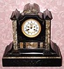 C.1900, French, Saumel Marti, Black Slate clock with open escapement on the dial, 8-day, gong striking. 