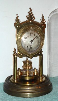 C.1905 German, Gustav Becker, for "BHA" 400-Day Clock. Earlier year clock with disc pendulum, silver and brass dial. — Antique Clocks Price Guide