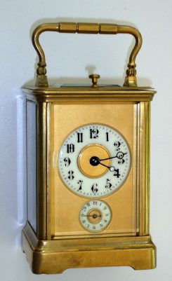 C.1900, French, Brass Cased Carriage Clock, Miniature case, 8-day time, qtr strike [petite sonnerie] and with alarm, in a Corniche case, round porcelain dials on a gilt mask. — Antique Clocks Price Guide