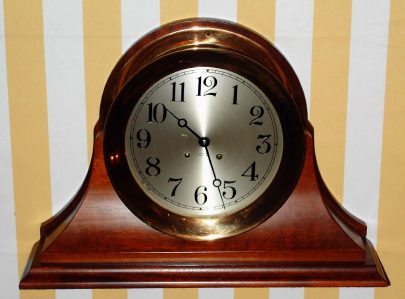 C.1991, Chelsea Clock Co., 8.5" Ship's Bell, hinged bezel, on original mahogany stand. — Antique Clocks Price Guide