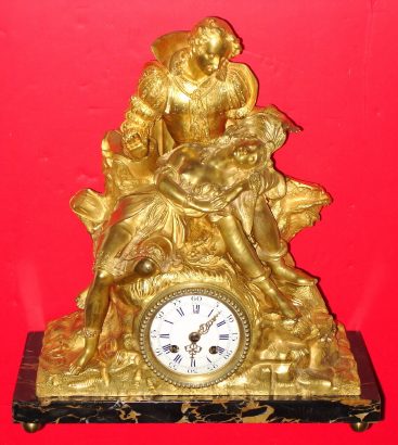 C.1870, French, Ormolu Figural Clock,  a gentleman in 16th century dress, holding his sleeping sweetheart in his lap, her breast exposed. The well made French striking movement of week duration. — Antique Clocks Price Guide
