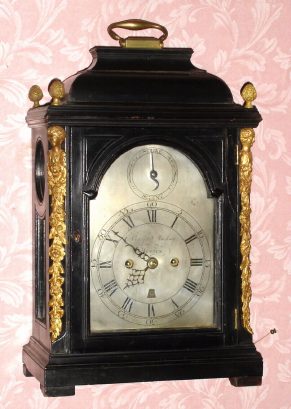 C.1800, Crafts Mackay, Boston, 2-fusee bracket clock with crown verge escapement and pull cord repeat, striking on a large bell, the case with caryatids to the corners and pineapple finials and brass dial with calendar aperture at 6. — Antique Clocks Price Guide