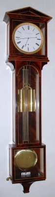 C.2006, Austrian Reproduction Laterndluhr, YEAR RUNNING, weight driven, full length compensating meter pendulum, knife edge susp, in a crotch mahogany veneer case with holly edge trim. — Antique Clocks Price Guide