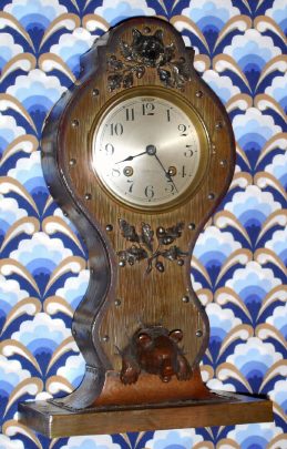 C.1911, Chelsea Clock Co., 4 1/4" dial, art nouveau metal and wood case in "Hunter" motif, with 8-day Ship's Bell movement. — Antique Clocks Price Guide