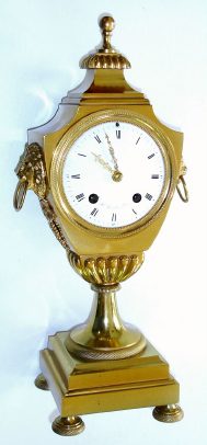 C.1825, French, Ormolu Mantel Clock in the stylized from of an urn, with lion and grape trim to the aides, and with a porcelain dial signed: "H. Laresche, Paris". — Antique Clocks Price Guide