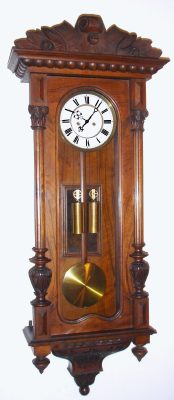C.1875, Austrian, 2-Wt "Vienna Regulator",  in a walnut case with an old carved top from another piece of furniture. — Antique Clocks Price Guide