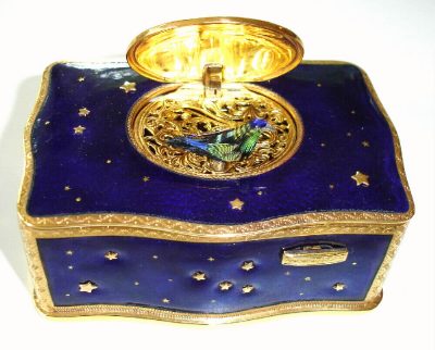 Late 20th Century, German, Singing Bird box, in a gilt and blue enamel case with gold stars showing through blue-stars on all sides, key wound from base. — Antique Clocks Price Guide