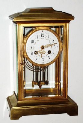 C.1913 [dated], French, Samuel Marti for Bailey Banks and Biddle, Philadelphia PA: Brass crystal regulator with 8-day time and strike movement and 2-glass vial pendulum. — Antique Clocks Price Guide