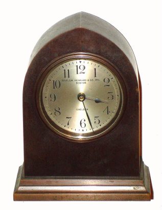 C.1927, Chelsea Clock Co., Boston, miniature GOTHIC, desk timepiece, with rear wind lever movement, this one retailed by Bigelow, Kennard and Co., Inc, Boston. Serial No. 189240. — Antique Clocks Price Guide