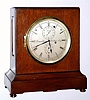 Mid 20th Century, Thomas Mercer, Ltd, St. Albans, England (1858-1954), No. 1131, 8-Day Chronometer table clock. Has a mahogany case with ebony stringing along the perimeter of all sides. Has a running "stop" at 1, bubble level on top of case, hinged brass bezel for winding, 11 jewel full chronometer detent platform is visible from top of case. There is info on the internet regarding Mercer, as well as in Ehrhardt's book 5, pages 103 and 129. 