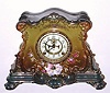 C.1910, Ansonia Royal Bonn, LA DROME,  porcelain china clock in dark New Art colors, very dark green top and bottom with lighter shaded front and dark pink accents, the porcelain dial with open escapement. 