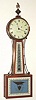 C.1972 (dated), Elmer O. Stennes, Weymouth, Mass, 8-day banjo clock, weight driven, in a cross banded mahogany case, marked MCIP. 