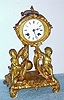 C.1850, French, Japy Farres, Paris: French Ormolu miniature shelf clock with cherubs and 8-day time and strike movement, the dial set into an oval easel. 