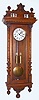 C.1885, German, Gustav Becker, 2-Wt, Vienna Regulator, in a walnut case with vines carved into the columns, and with original top, mov't with 2 hammers and striking bim-bam [not quarters]. 