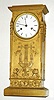 C.1825, French, Lesieur, Gilt Bronze Empire mantel clock, 8-day, bell strike, the case with musical lyre on the front and wreaths to the sides, with a full length torch at each corner. 