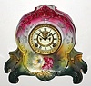 C.1904, Ansonia Clock Co., LA RIVIERE, Royal Bonn porcelain clock with open escapement dial, in a tri-color case, dark rose at top, next yellow and bottom dark green, and with brilliant floral decorations. 