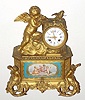 C.1880, Vernet, 38 Rue du Bac, Paris, French, Ormolu figural clock: Cherub and mermaid castings and three porcelain inserts with an 8-day time and strike movement. 