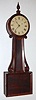 C.1840, Attleboro Banjo Timepiece,  8-day weight driven in a mahogany paneled case with carved wood side arms. 