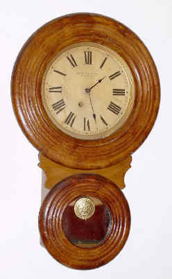 C.1892 Baird Clock Co., 8-day miniature wall clock, plain. This case style appears to have not been very popular, and only a few were manufactured (there is NO advertising). — Antique Clocks Price Guide