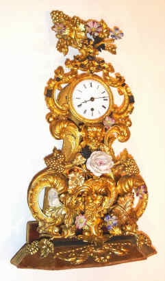 C.1850, French, Small Repousse w/ porcelain flowers, fantasy timepiece, movement signed Jeanperin, a' Paris, No. 7701. — Antique Clocks Price Guide