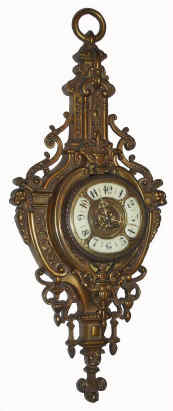C.1900, French, Cast Bronze CARTEL clock, 8-day time and strike, with interesting 4-piece porcelain dial, the heavy case with swags and acanthus buds and gargoyles at the side. — Antique Clocks Price Guide