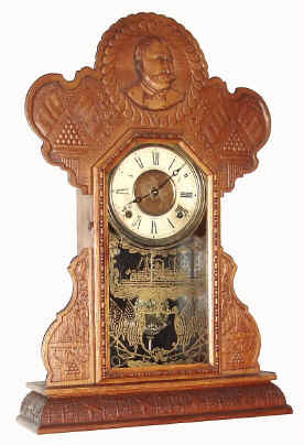 C.1900, E. Ingraham and Co., DEWEY model pressed oak commemorative of this famous admiral who defeated the Spanish in the harbor at Manila in 1898. — Antique Clocks Price Guide