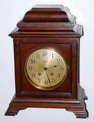 C.1917, Chelsea Clock Co / cased by Tiffany, mahogany mantel clock with 8-day time and house strike movement, serial No. 112830, and with a different Tiffany number on case. Silvered dial is 5" — Antique Clocks Price Guide
