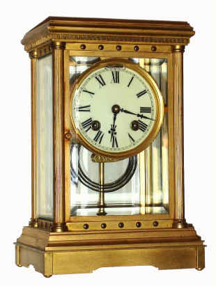 C.1895, Ansonia Clock Co., 4-Glass fancy crystal regulator with Corinthian columns at each corner, identical to the case used by Boston Clock Co for their DELPHUS model. Also has a platform lever on the real plate, time and gong strike. — Antique Clocks Price Guide