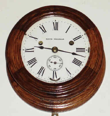 C.1904, Seth Thomas Clock Co, "WARDROOM" Ship's Bell clock, 1-day, in a 2-color oak case, with porcelain dial. — Antique Clocks Price Guide