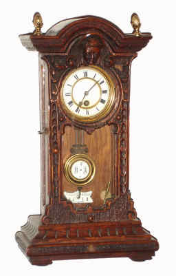 C.1880, German, Mini "R-A" Spring Vienna, in a carved oak mantel style walnut case, 8-day, finished in walnut color . — Antique Clocks Price Guide