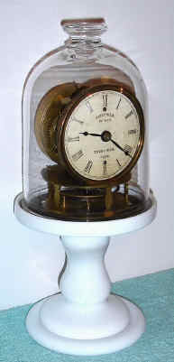 C.1853, Terryville Manufacturing Co., Terryville, Conn, CANDLE STAND TIMEPIECE, balance wheel type, as patented on Nov 29, 1853. — Antique Clocks Price Guide