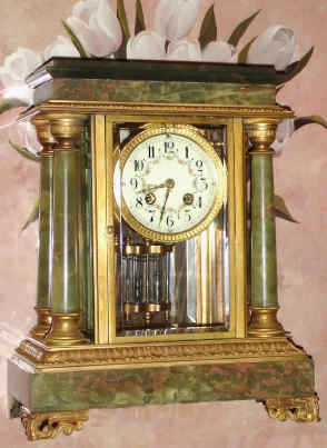 C.1895, French, Japy Freres, Ormolu and Onyx, 4-glass "Crystal Regulator", with 4 free standing onyx columns, onyx base and top, the whole with gilt cast bronze capitals and accent trim, and with a creamy porcelain dial w/ polychrome decorations, and original 2-vial compensating pendulum. — Antique Clocks Price Guide