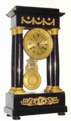 C.1860, French, "F-C", 4-Column Empire style mantel clock, in an ebonized case with gilt bronze mounts, (swags and floral elements) gilt dial and pendulum, and with original glass dome and base. — Antique Clocks Price Guide