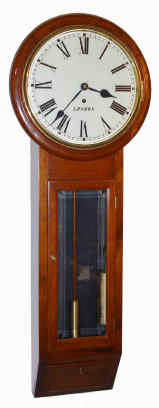 C.1890, English, 1-Wt Regulator, or tavern timepiece in a well made case of English Walnut, the robust 8-day movement with large pillars and maintaining power, and with Graham's dead beat escapement, wt descends right side of case. — Antique Clocks Price Guide
