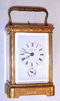 C.1890, French, Brass Cased Carriage clock, time, strike, repeat and alarm, in a profusely engraved and gilded case with inset corners, the dial signed for Happacher in Wien, the retailer. — Antique Clocks Price Guide
