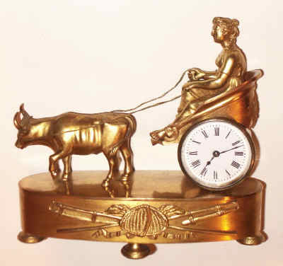 C.1870, French, Mini Figural clock, Lady in Ox Cart, 8-day timepiece, with small platform lever movement. — Antique Clocks Price Guide