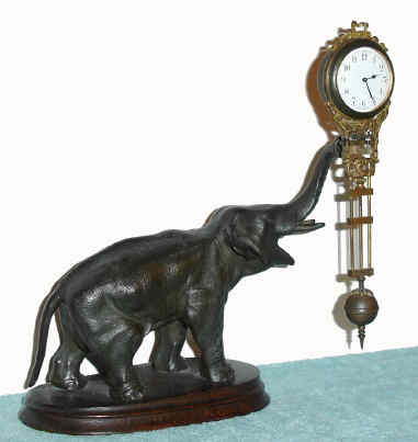 C.1905, German, ELEPHANT SWING, 8-Day novelty timepiece, the support bar for the clock held at the end of the elephant's trunk. — Antique Clocks Price Guide